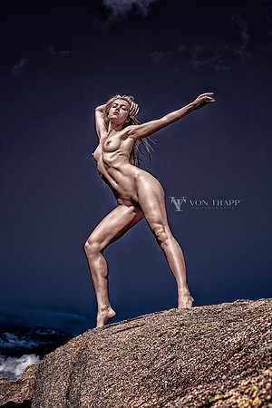 Fine art nude photo of a hot blonde posed outdoors in the Texas hill country.