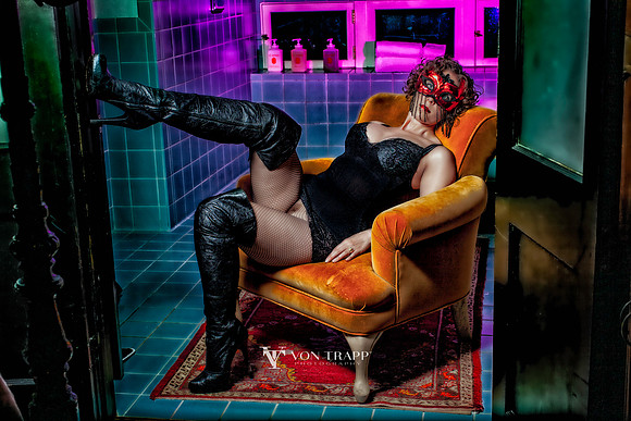 Glamour photo of a woman in lingerie, flashing her coochie.