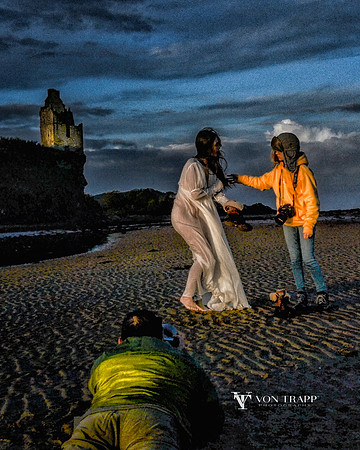 Behind the scenes of a beach photo shoot below Grennan Castle, Scotland.
