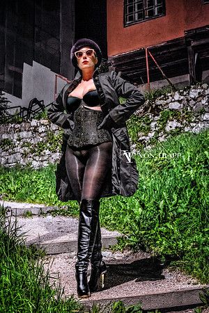 Fashion-glamour photo of a hot woman, taken outside at night in Cortina, Italy. Erotic photo. Exposed boobs. Flashing in public.