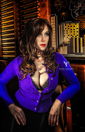 Sexy glamour photo of a busty woman in a tight Angora sweater.