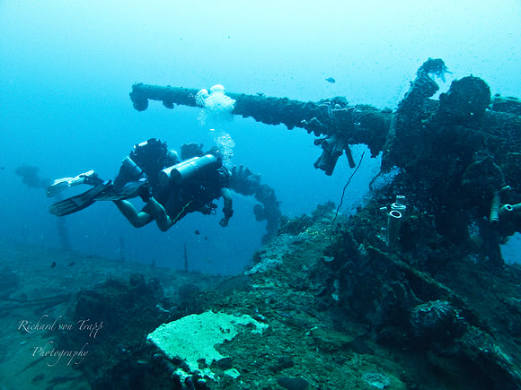 Underwater photo of a WWII deck gun on a Japanese Destroyer in Truk Lagoon at 175 feet.