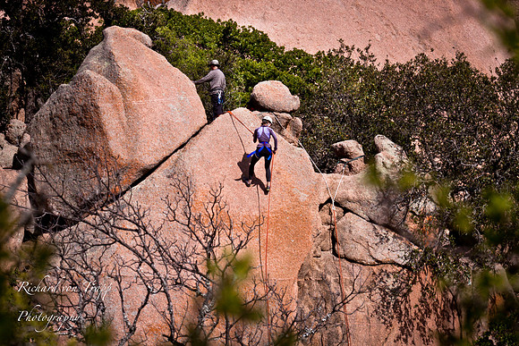 Woman rappelling, Enchanted Rock Texas by New Braunfels and San Antonio Glamour Photography.