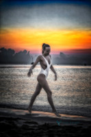 Fine art photo of woman on beach at sunrise