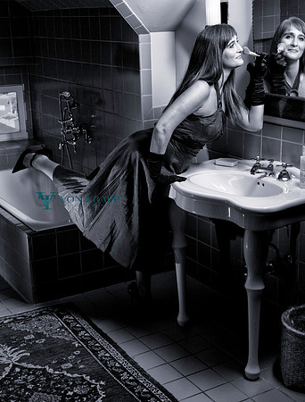 Photo of a sexy mature woman in a boudoir photo.