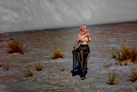 Art nude photo for sale of a woman dressed in gauze skirt and head scarf, walking in a desert.