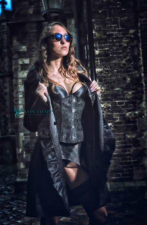 Edgy glamour photo of a Dutch woman in lingerie flashing outdoors.