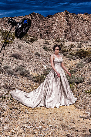 BTS photo of a wedding gown shoot in the desert.