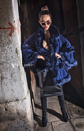 Fashion glamour image of a woman in a Venice wearing lingerie outdoors at night.
