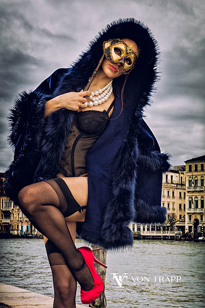 Fashion photo of a woman in lingerie outdoors in Venice Italy.
