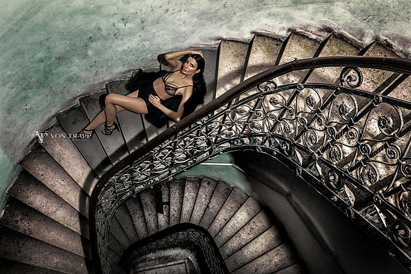 Fashion image of a woman in lingerie on a stairway in Budapest.