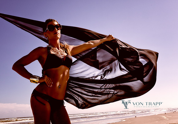 Fashion image o a woman on a beach.