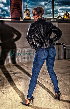 Sexy fashion photo of a hot woman in tight jeans and CFM stilettoes posed in an fashion photo.