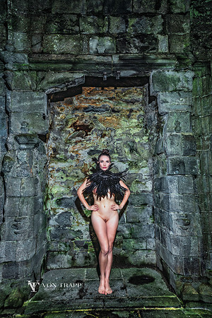 Art nude photo created in front of a huge fireplace within a Scottish castle.