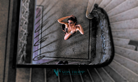 Photo of a woman wearing lingerie in a Budapest stairway.