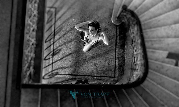Photo of a woman wearing lingerie in a Budapest stairway..