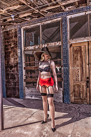 Lingerie-Glamour photo of a sexy woman in stockings and stilettoes outdoors in West Texas.