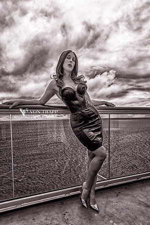 Sexy Fashion photo of a hot busty woman in a tight Agent Provocateur dress.