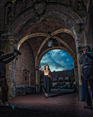 Fashion Glamour shoot in public of a topless model.