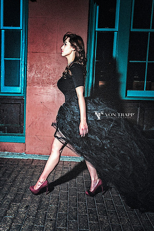 Fashion-Glamour photo of a very busty woman walking down the street.