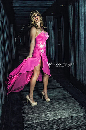 Photo of a woman wearing a sexy high slit gown.