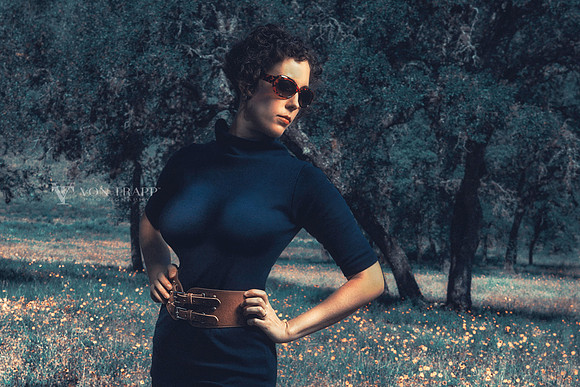 Photo of a busty woman outdoors in a field of wildflowers in Texas.