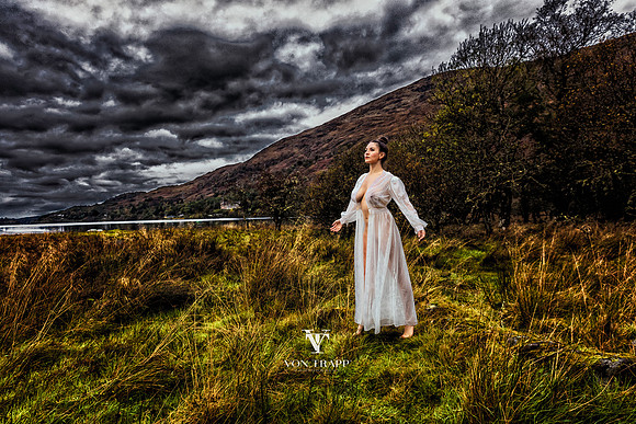 Color fine art photo of a busty beauty, posed in a sheer vintage night gown and taken in the Scottish Highlands.