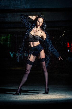 Fashion Glamour photo of a lovely woman wearing lingerie in an outdoor parking garage.