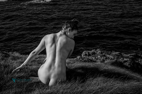 Art nude in black and white created on a bluff above the ocean in Scotland.