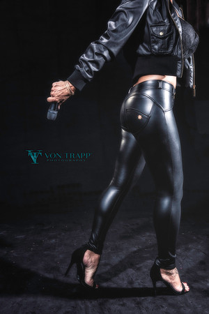 Photo of a sexy woman in skin tight leggings.