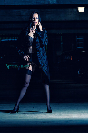 Photo of Austin Author J.M. Buckler in lingerie in a parking garage.