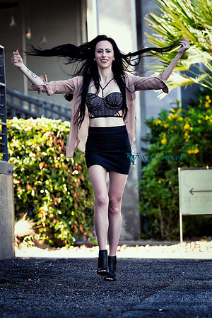 Glamour photo of a dark haired woman. Austin author J.M. Buckler.