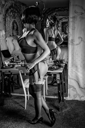 Boudoir photo of a hot woman with a fine ass wearing lingerie.