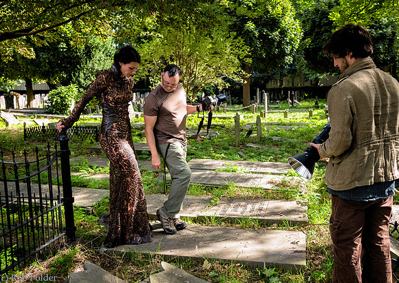 Behind the Scenes photo taken in Naarden Holland of a photographer and assistant photographing a woman outdoors.