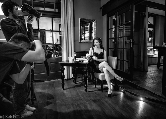 Behind the Scenes photo taken in Naarden Holland of a photographer and assistant photographing a woman.