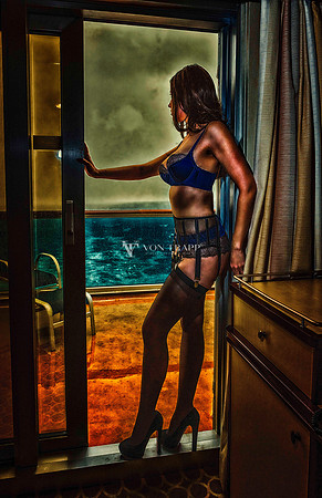 Stylized lingerie photo of a woman on board a cruise ship.