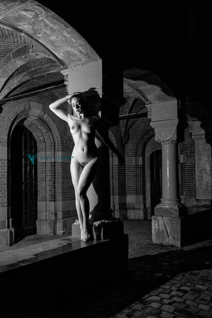 Art nude photo taken at night in Naarden Vesting, Holland of a lovely Dutch beauty.