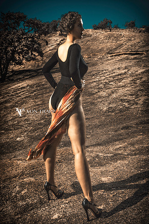 Photo of a sexy-leggy woman in stilettoes and a bodysuit taken in the Texas Hill Country.