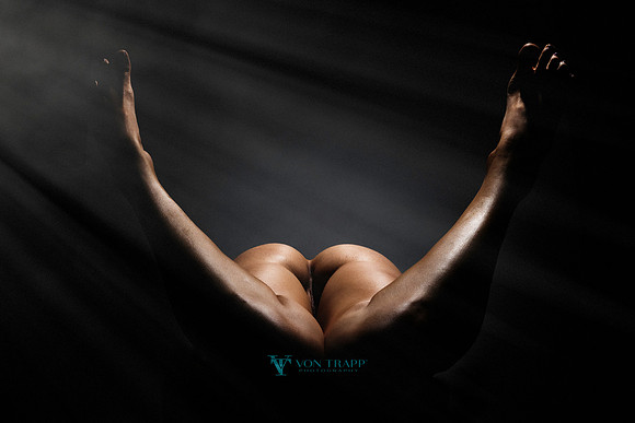 Erotic art nude photo of a woman's butt, pussy and legs.