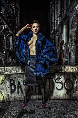 Fashion photo of a sexy woman flashing a boob in public and nighttime in Venice Italy.