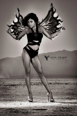 Photo of a sexy she-devil in a provocative outfit on a dry desert lakebed in Nevada. San Antonio glamour photography.