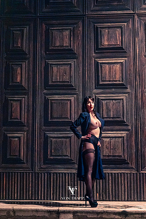 Sexy glamour photo of a hot topless woman, flashing at nighttime in Venice.
