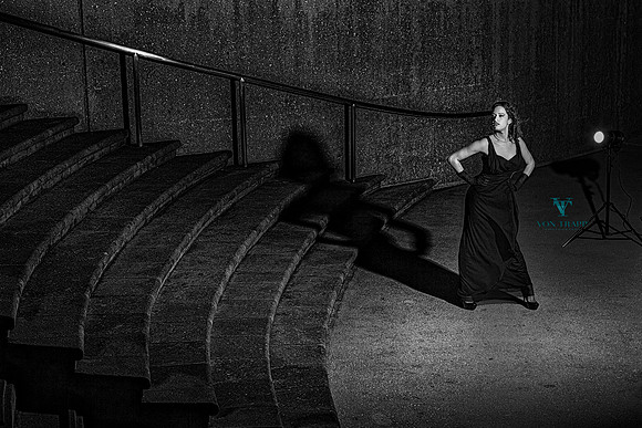 Fashion photo taken outdoors at nighttime in San Antonio of a woman in a long gown.