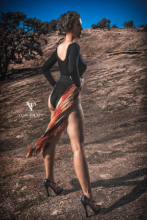 Glamour photo of a leggy beauty in stilettos, photographer in the Texas hill country.