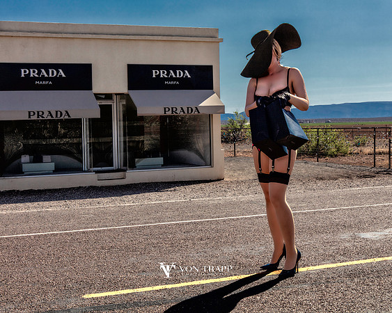 Sexy fashion-glamour photo of a leggy woman dressed in lingerie, standing on a Texas road.  Prada
