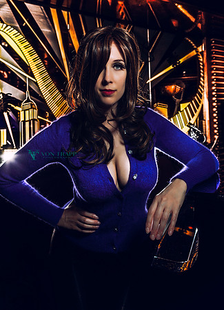 Sexy glamour photo of a busty woman showing a lot of cleavage in a tight fuzzy sweater.