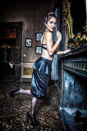Sexy fashion photo of a woman in a palazzo in Venice, Italy.