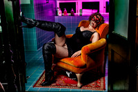 Glamour photo of a woman in lingerie, flashing her coochie.