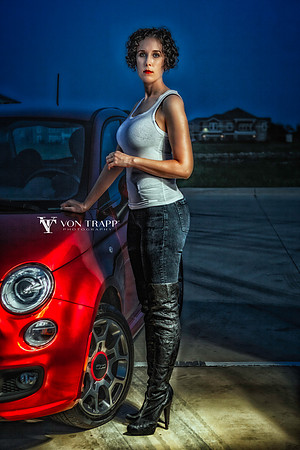 Glamour photo of a hot woman in a tight tank top, jeans, a come-fuck-me thigh-high boots.