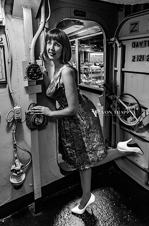 B&W retro-inspired pin up photo of a woman aboard the USS Lexington.